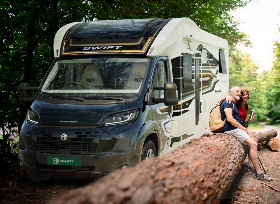 Swift Kon Tiki motorhome with couple sat outside