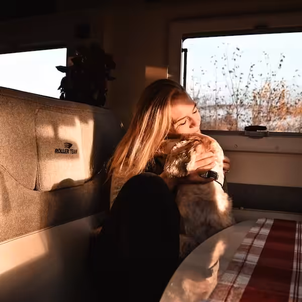 2026 Roller Team Woman Hugging Dog