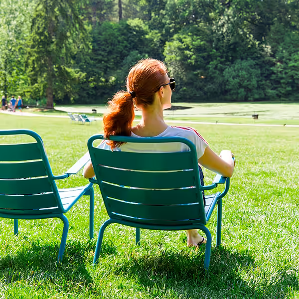 Woman On Relaxing Chair Outside Square